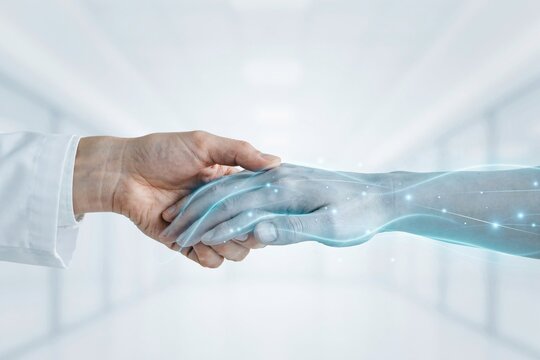 A compassionate medical professional gently holding a futuristic artificial intelligence robotic hand in a clinical environment