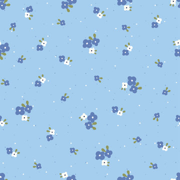 Seamless pattern with cute tiny blue and white flowers on light blue background. Ditsy floral vector illustration for spring summer fabric print, wrapping paper, textile, wallpaper and baby clothing.