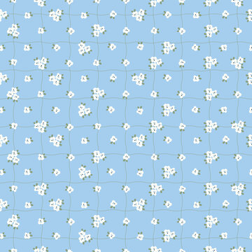 Seamless pattern with cute tiny white flowers on hand drawn wavy grid light blue background. Retro ditsy floral vector illustration for fabric textile print, wrapping paper, and spring wallpapers.