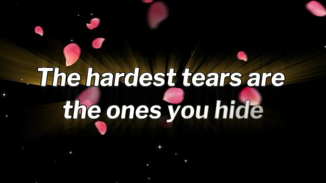 Inspirational quote 'The hardest tears are the ones you hide' is displayed in white text surrounded by falling pink flower petals on a dark background with golden light rays.