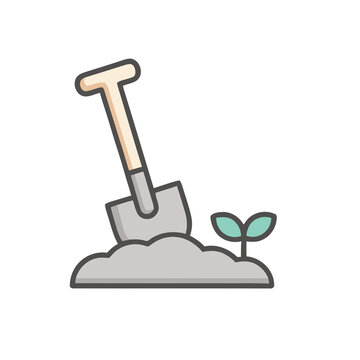Shovel digging soil next to plant sprout