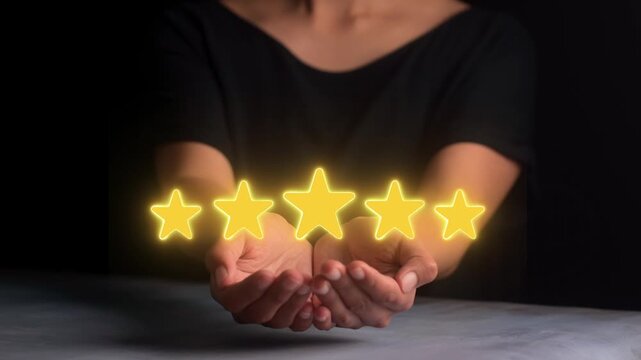 Customer holding five glowing yellow stars between hands for satisfaction rating concept