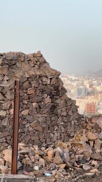 Historic stone wall ruins and old masonry structures at the Masjid Al Fath site in Medina.