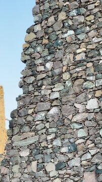 Ancient stone ruins and historic architecture at Masjid Al Fath in Medina.