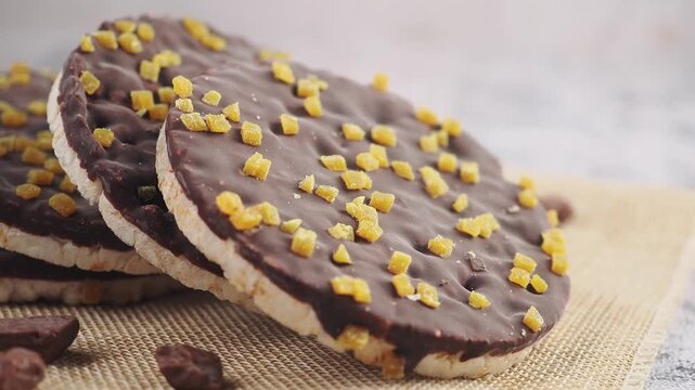 Chocolates with crunch pieces displayed on a surface
