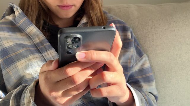 Teenage girl hands holding smartphone close up, digital technology, mobile device