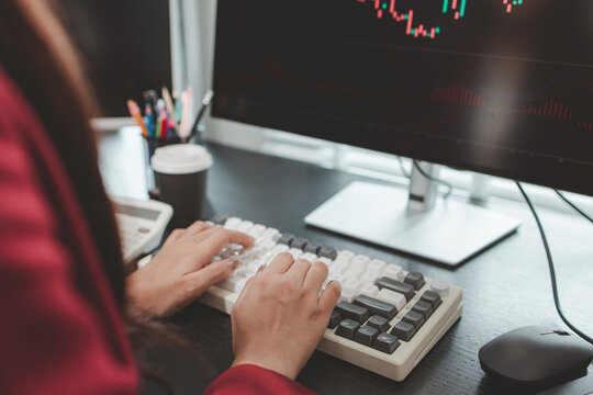 Financial analyst monitoring market trends and investment performance in modern office, representing stock trading, technical analysis, portfolio management and professional financial decision making.