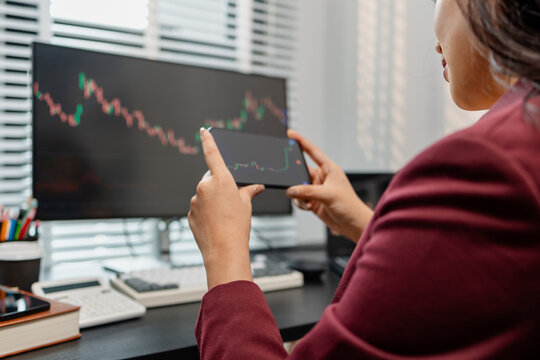 Professional investor monitoring financial markets and analyzing investment opportunities in a modern office, representing stock trading, market research, portfolio management.