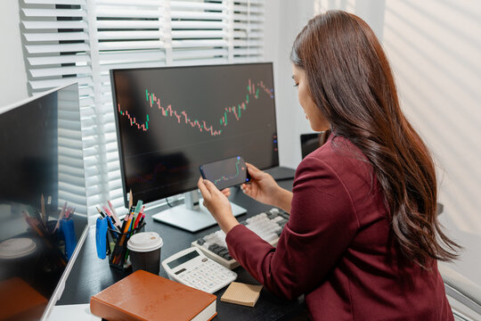 Professional investor monitoring financial markets and analyzing investment opportunities in a modern office, representing stock trading, market research, portfolio management.