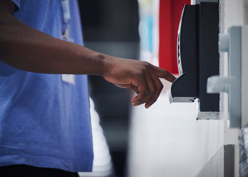 Employee Using Electronic Access System at Secure Facility