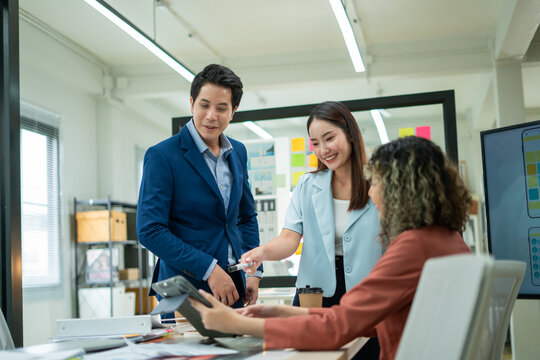 Asian business team meeting conference discussion concentrate private ideas data report analysis business people working find solution together in office.brainstorming,analyzing,planning,strategy