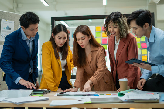 Asian business team meeting conference discussion concentrate private ideas data report analysis business people working find solution together in office.brainstorming,analyzing,planning,strategy