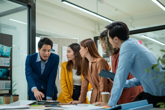 Asian business team meeting conference discussion concentrate private ideas data report analysis business people working find solution together in office.brainstorming,analyzing,planning,strategy