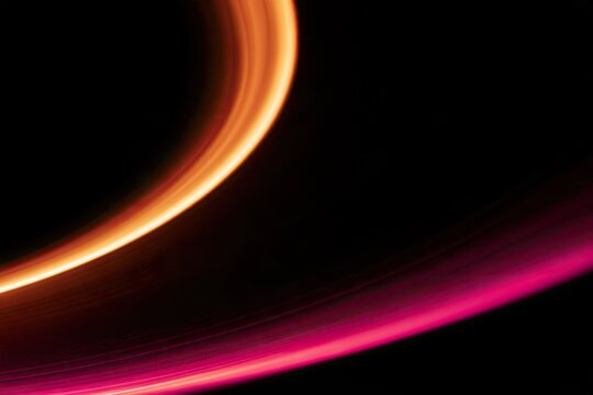 Glowing cosmic ring curves and swirls against deep black void