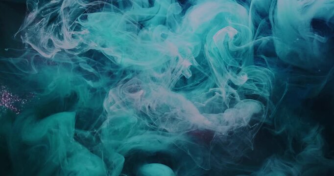 Color dye cloud. Underwater paint drop. Defocused blue purple bright glitter splash water pigment spreading on abstract art vibrant background.