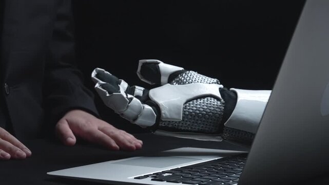 Image depicts a human and a robotic hand in a legal context, emphasizing the role of artificial intelligence in ethical decision-making and technology in the modern world. Salient