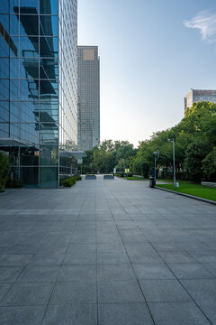 Modern urban plaza between office buildings on sunny day