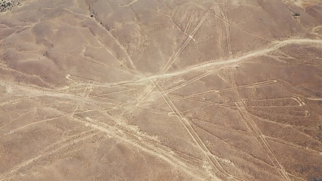 Close aerial view of intersecting desert lines