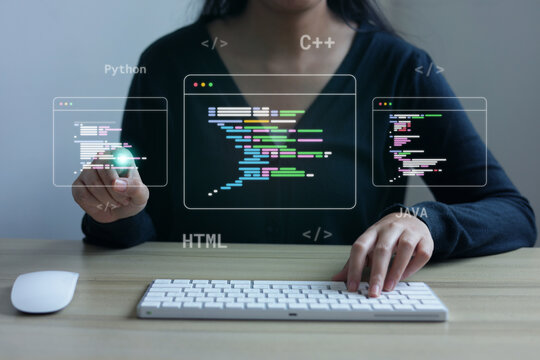 Female Programmer Touching Floating Coding Screen while Typing on Keyboard