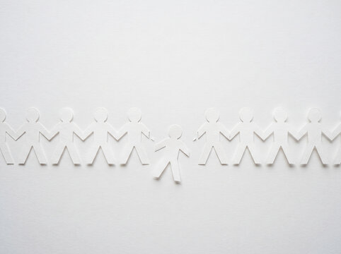 White Paper Cutout People Chain Holding Hands Horizontally
