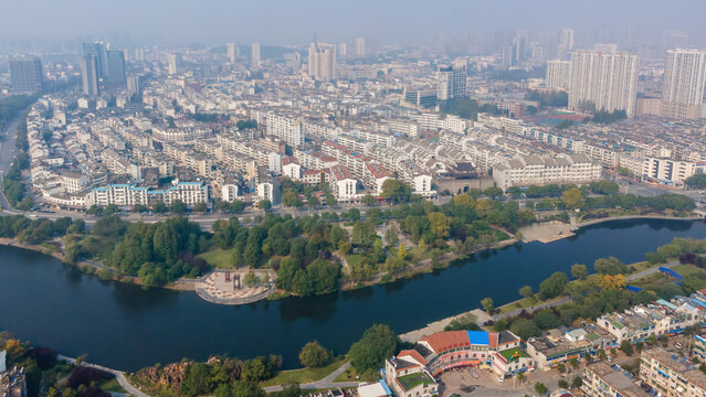 Aerial View of Urban Landscape with River and Green Park