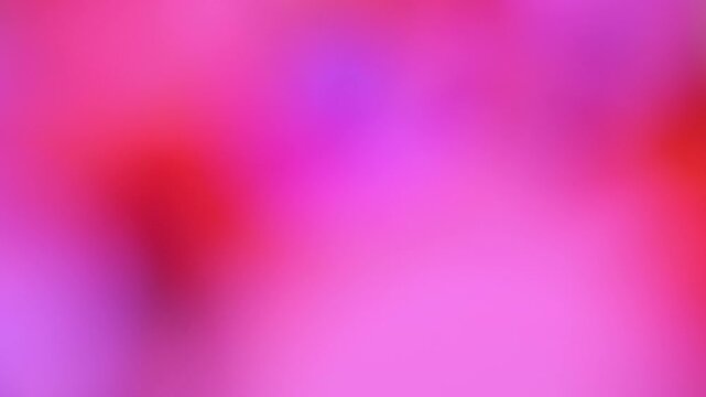Abstract pink and red gradient background with soft bokeh