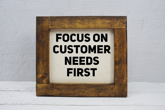 Focus On Customer Needs First text written on wooden board