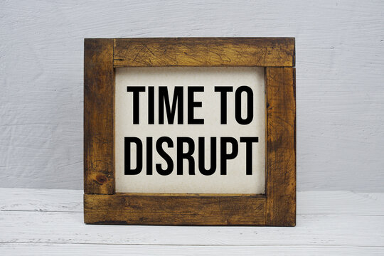 Time To Disrupt text written on wooden board