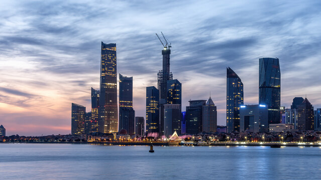 Coastal City Skyline at Dusk with Modern Skyscrapers