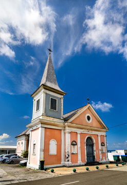 The historic Saint Catherine of Alexandria Church, a charming pink and white church under a blue sky in Grand Riviere, Martinique