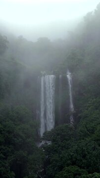 Vertical Aerial View of Barki Waterfall Amid Lush Green Forest Kolhapur Maharashtra