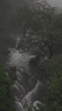 Vertical Aerial View of Barki Waterfall Amid Lush Green Forest Kolhapur Maharashtra