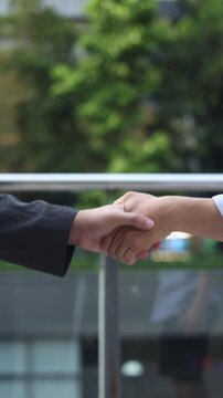 slow motion scene of investor businessman handshake with partner vendor to agreement or deal financial project concept