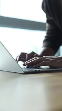 slow motion scene freelancer man hand type on laptop keyboard to search about information or data on internet or working and reply email to client for digital nomad and technology concept