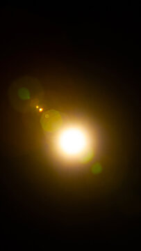 Sun flare on the black background