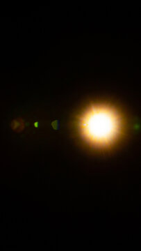 Sun flare on the black background