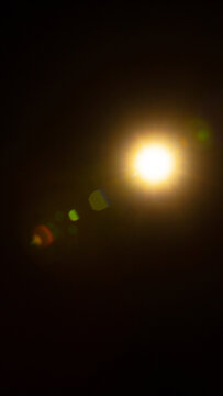 Sun flare on the black background