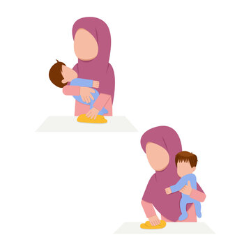 Hijab Mother Cleaning Table While Holding Baby