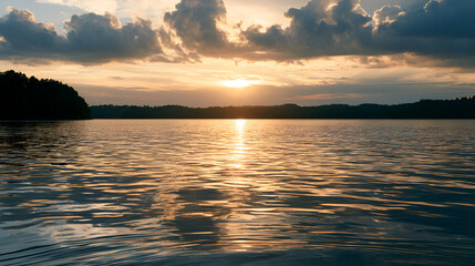 Fototapeta premium Golden Sunset Clouds Reflecting Warmly Over A Calm Lake, Soft Golden Hour Light, Shot On 85mm Lens, Shallow Depth Of Field, Cool Muted Blue-Gray Palette, Photorealistic, Ultra-Detailed