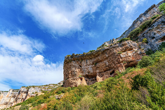 Walking through the Foz de Lumbier canyon in the Aragon Pyrenees. Spain. Europe. Watching Vultures