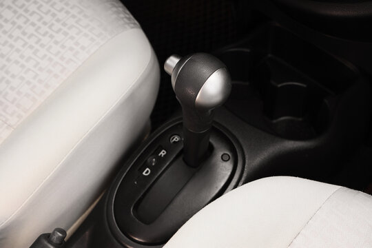 Automotive transportation and driving safety, automatic gear shift lever in modern car interior with park and drive modes for vehicle travel and commute
