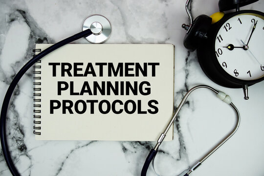 Treatment Planning Protocols text written on notepad with stethoscope and alarm clock on marble background
