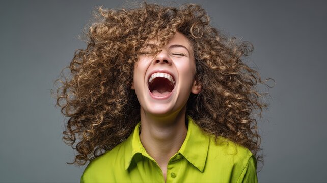 Joyful Woman Laughing with Curly Hair