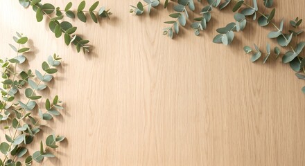 Top-down view of light oak wooden table background with eucalyptus leaves © Masahiro Chiba