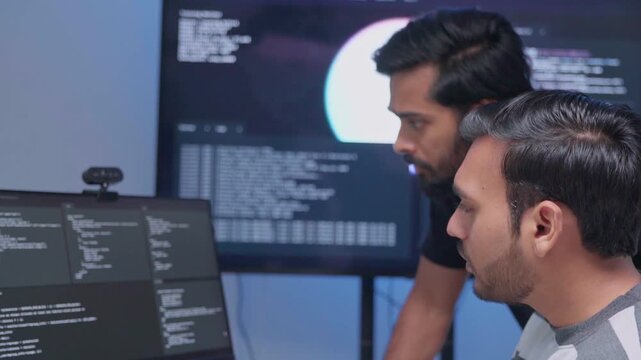 Team engineers software development are brainstorming using computer writing code. Programmer teamwork meetings using technology artificial intelligence work system about cyber security and coding