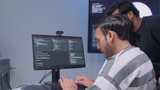 Team engineers software development are brainstorming using computer writing code. Programmer teamwork meetings using technology artificial intelligence work system about cyber security and coding