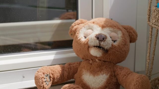 Green flies are crawling all over the old teddy bear close-up