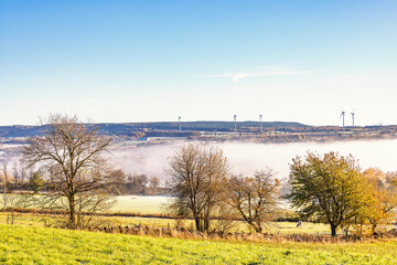 Naklejka premium Rural landscape view a autumn morning with mist in a valley