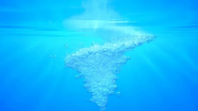 Underwater air bubbles rise and swirl in a blue vortex beneath the water surface with light rays diffusing through the fluid. Rising motion creates light diffusion and visible depth.