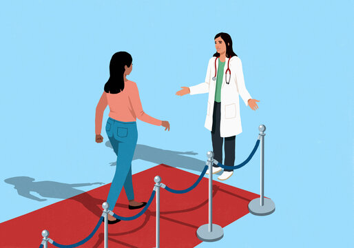 Female doctor welcoming patient approaching on red carpet